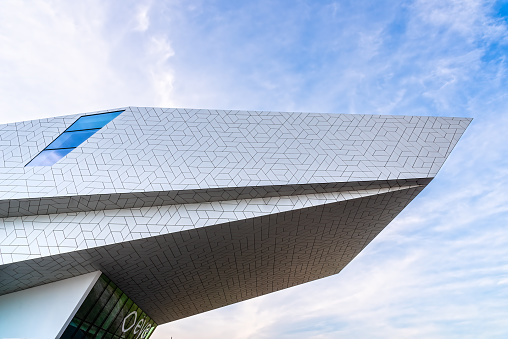 Amsterdam, Netherlands - May 6, 2022: Eye Film Museum designed by Delugan Meissl Associated Architects. Detail of facade. View against blue sky