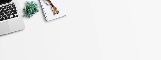istock Office desk top view with stationary on white background 1403005032