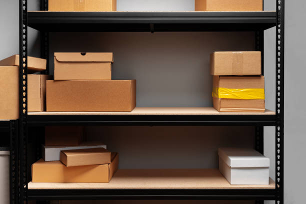 istock Rows of shelves with cardboard boxes in modern warehouse 1403005640