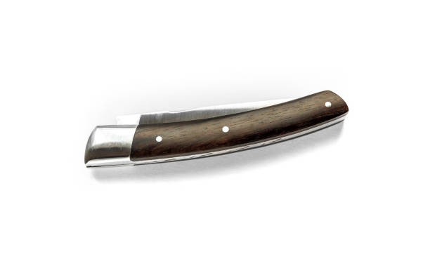 istock Traditional wooden pocket knife isolated on white background 1403005749