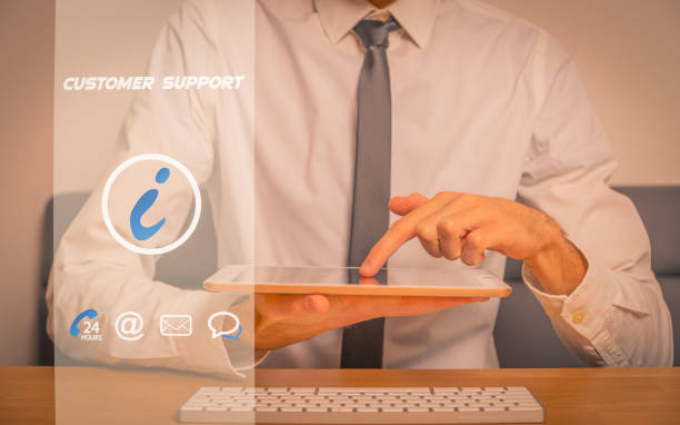 istock Businessman holding smartphone to contact the customer support 1403008910