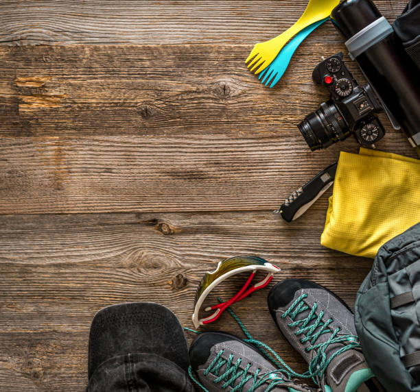 istock Trekking equipment on wooden background 1403009817