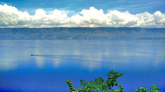 Lake Toba is the largest lake in Southeast Asia. Samosir Island is located in the middle of Lake Toba. Samosir Island will look like a long mountain that stands above Lake Toba when viewed from a certain spot.
