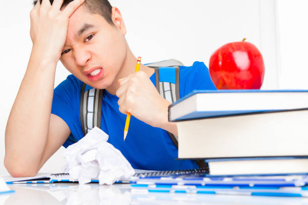 istock Stressed out asian college student 1403011259