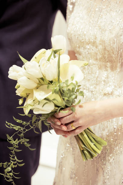 istock The bride holds a bouquet 1403011437