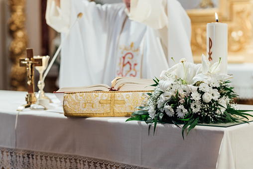 Close up view of a the altar of a church during a wedding ceremony. Wedding and religion concept.