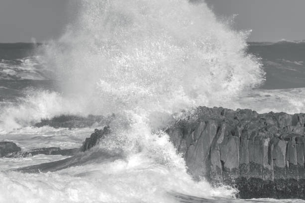 istock Turbulence - A wild day at the seaside in black and white 1403016646