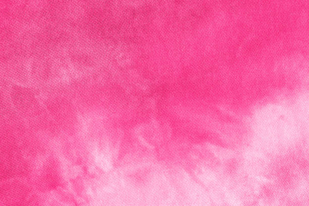 Abstract pink tie dye fabric cloth boho pattern texture Abstract tie dye magenta pink fabric cloth Boho pattern texture for background or groovy wedding card, sale flyer, 60s, 70s poster, kid tie-dye diy backdrop. Modern Watercolor Wet Brush Fabrics Art substance intoxication stock pictures, royalty-free photos & images