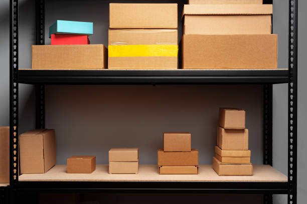 istock Rack shelves with paper boxes in warehouse. 1403017965