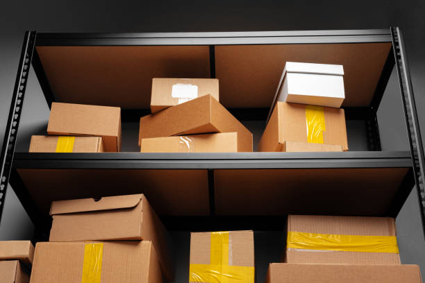 istock Rows of shelves with cardboard boxes in modern warehouse 1403018059
