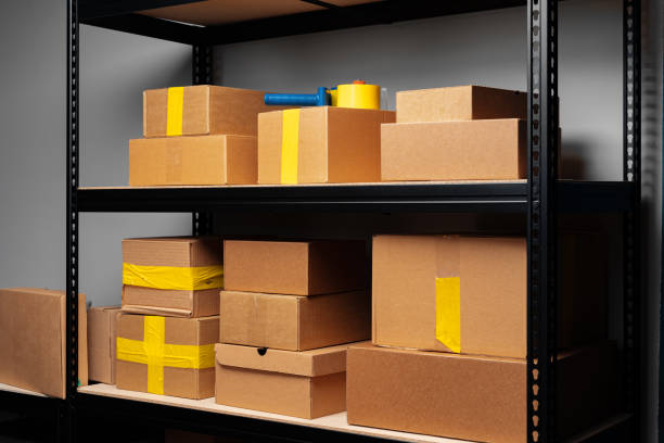 istock Rack shelves with paper boxes in warehouse. 1403018297