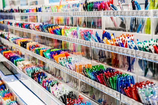 Various pens on display at stationery shop. Back to school office supplies shopping