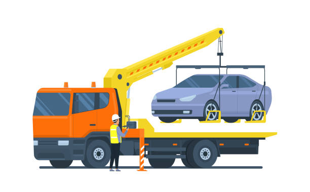 ilustrações de stock, clip art, desenhos animados e ícones de the driver of the tow truck is loading the car. vector illustration. - tow truck heavy truck delivering