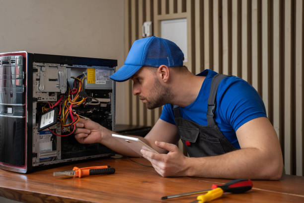 istock Man in t-shirt repairs computer system unit with screwdriver 1403026009
