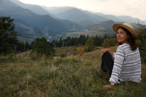 istock Woman enjoying beautiful mountains landscape. Space for text 1403027464