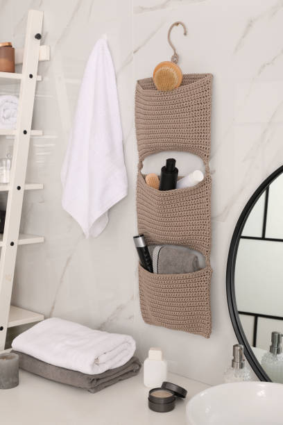 istock Knitted organizer hanging on wall in bathroom 1403030090