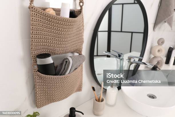 Knitted Organizer Hanging On Wall In Bathroom Stock Photo - Download Image Now - Bathroom, Organization, Storage Compartment