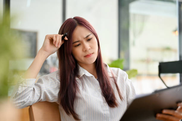 istock Thoughtful asian businesswoman pensive thinking the solution plan, finding an inspiration idea 1403030871