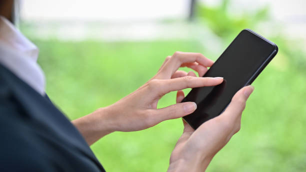 istock A female using modern smart mobile phone, touching on screen, scrolling on social media. 1403031034