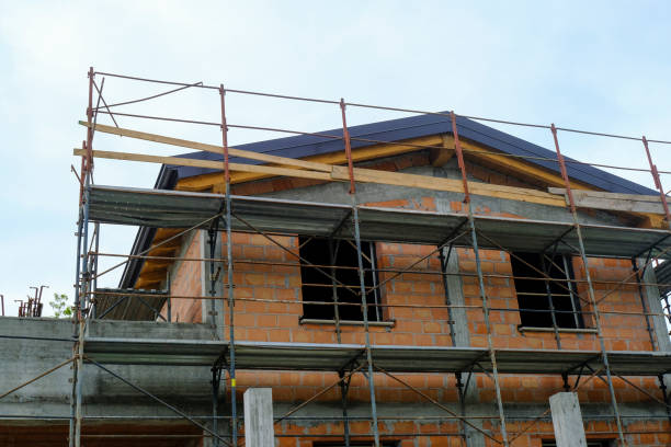 istock construction site with equipment and building. House in construction close-up. Building construction site. Construction works. Roof works from beneath across the sky 1403031502
