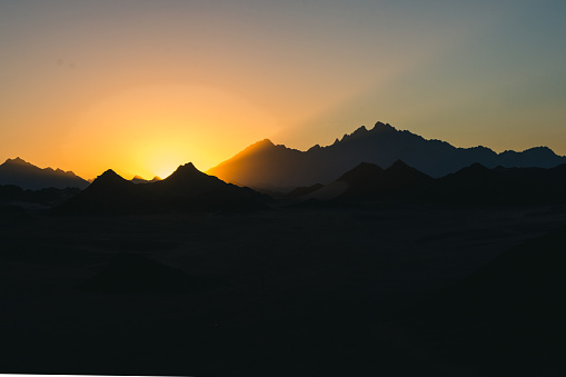 Silhouette of mountains as the sun sets in the Eastern Desert in Hurghada, Egypt