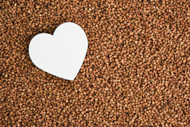 istock White heart on the background buckwheat. 1403036007