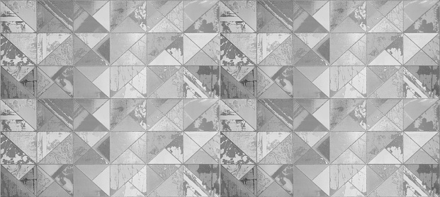 Abstract gray grey white triangular cement concrete stone mosaic tiles, tile mirror or wallpaper texture with geometric hexagon triangles background banner panorama