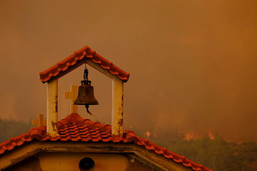 Exterior view of burnt a church after a wildfire in Euboea, Greece on August 8 , 2021.