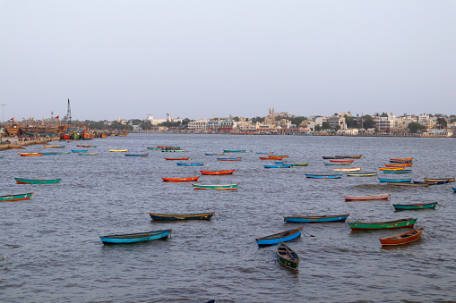Fishing boats on the shallows and view of the village. Sightseeing in Diu Places to Visit in Diu Island. India, Diu ghoghla, daman. the coastline of Arabian sea. Beautiful landscape.