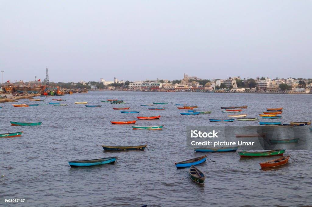 Fishing boats on the shallows and view of the village. Sightseeing in Diu Places to Visit in Diu Island. India, Diu ghoghla, daman. the coastline of Arabian sea. Beautiful landscape. Beach Stock Photo