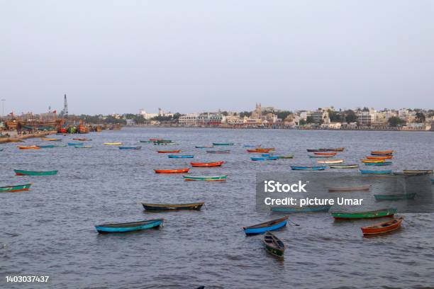 Fishing Boats On The Shallows And View Of The Village Sightseeing In Diu Places To Visit In Diu Island India Diu Ghoghla Daman The Coastline Of Arabian Sea Beautiful Landscape Stock Photo - Download Image Now