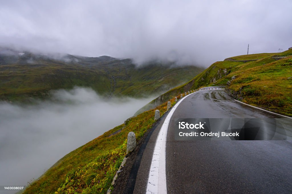 Cloudy and rainy day in Furka pass in Switzerland. Furka Pass Stock Photo
