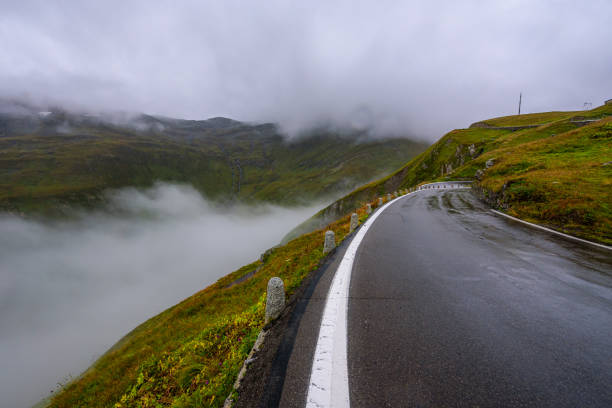 Cloudy and rainy day in Furka pass in Switzerland. Cloudy and rainy day in Furka pass in Switzerland. furka pass photos stock pictures, royalty-free photos & images