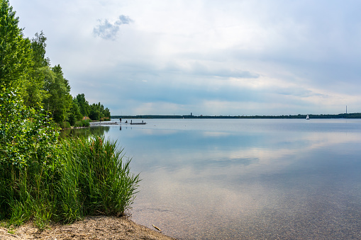 A calm summer day at the Cospudener Lake in Leipzig, Germany