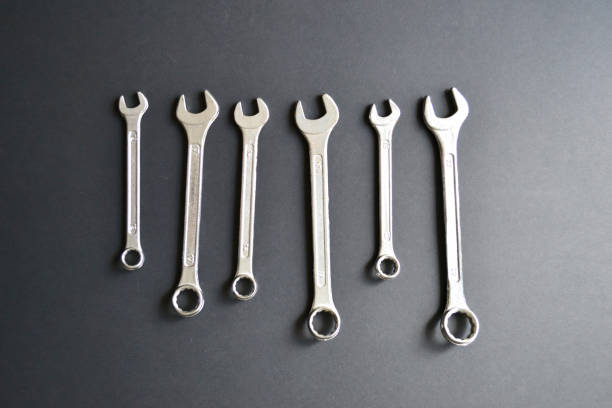 istock Steel wrenches on black background. Tools banner 1403040107