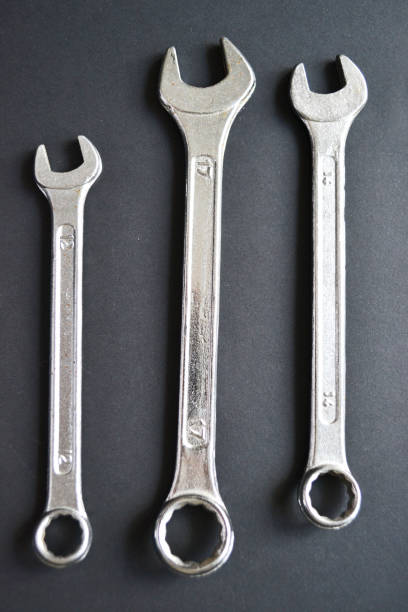 istock Steel wrenches on black background. Tools banner 1403040219