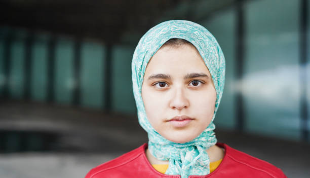 istock Young muslim girl looking at camera outdoor - Focus on eyebrows 1403040843