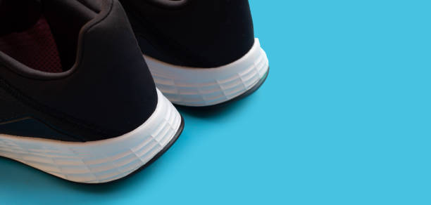 istock Sneakers shoes on blue background. 1403041068