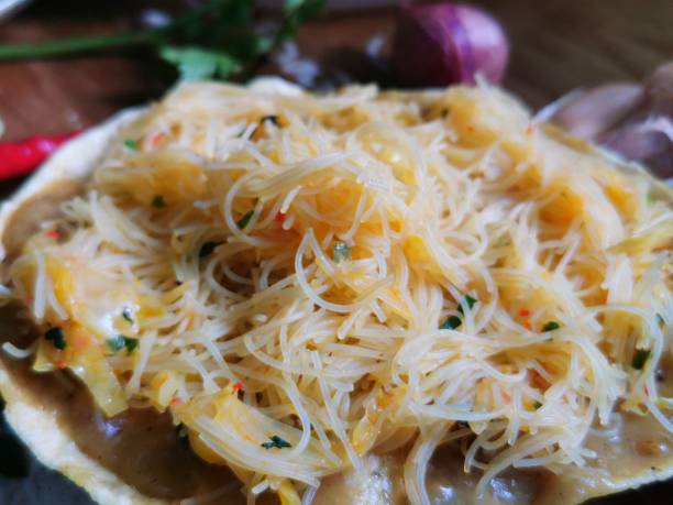 istock Opak Padang complete with cassava crackers, satay sauce, and fried rice noodles 1403041152