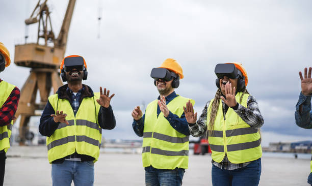 istock Multiracial workers using virtual reality headsets at Freight Terminal Port - Focus on african woman hands 1403043217