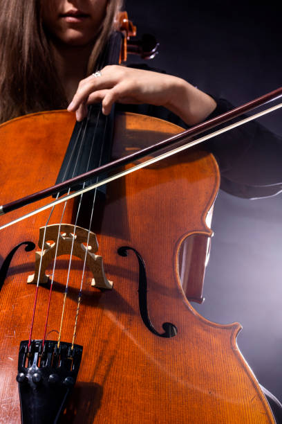 istock Beautiful girl cellist playing sonata 1403045098