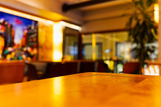 istock An empty wooden table inside the cafe bar and blurred background 1403045461