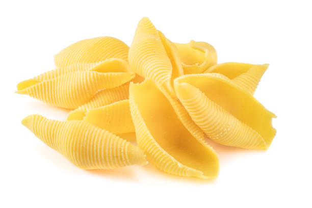 istock Fresh natural Conchiglioni pasta isolated on a white background, macro 1403045635