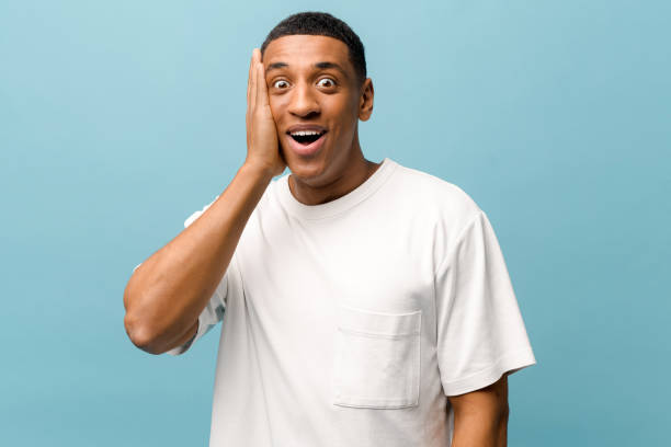 istock Stunned African-American guy looking at the camera with mouth open 1403045856