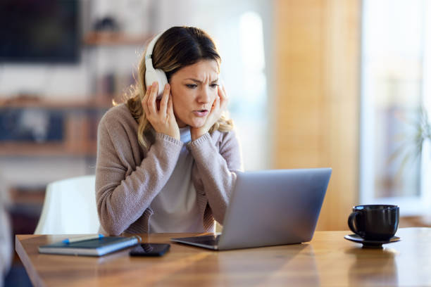 istock Young woman having a video call at home office. 1403047395