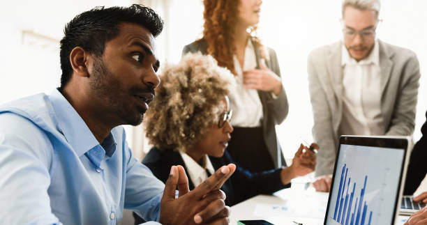 istock Multiracial business people working inside bank office - Focus on indian man face 1403048544