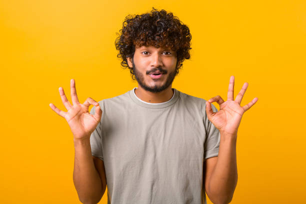 istock Everything is fine. Satisfied bearded curly Indian man showing ok gesture with fingers 1403048601
