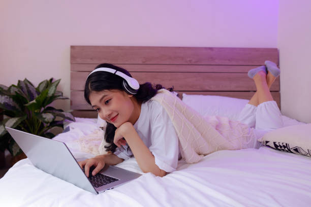 istock Girl in Pajama Lying on Bed 1403053089