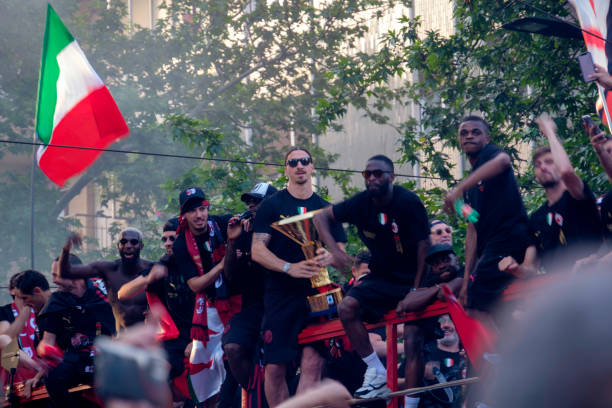 AC Milan players parade through the streets of Milan to celebrate winning the Scudetto stock photo