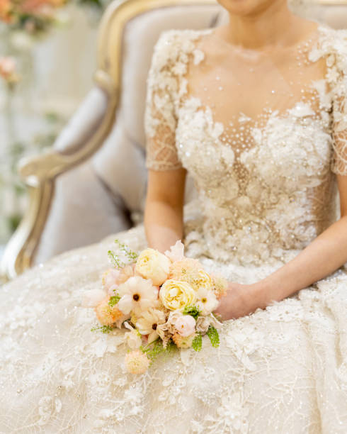 istock Bride sitting with a bouquet in the waiting room 1403053466